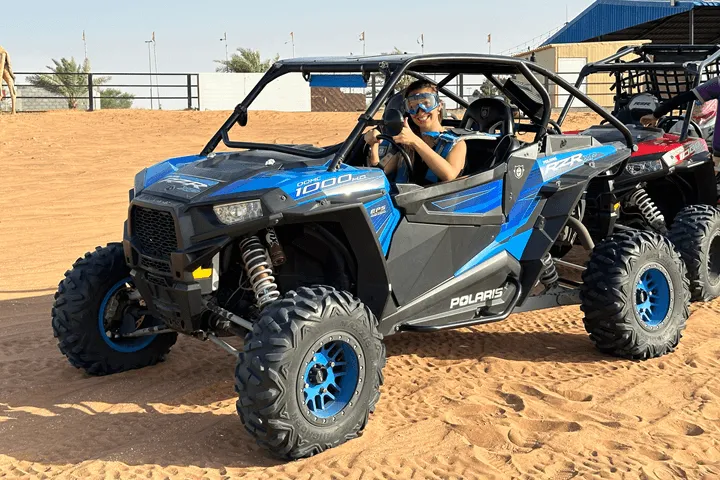 Women waving from a blue Polaris RZR 1000cc during 2 Seater Polaris Buggy For 1 Hour.